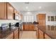 Bright kitchen featuring granite countertops, stainless steel appliances and light brown cabinets at 5224 E San Palo Dr, Pahrump, NV 89061
