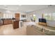 Open-concept living room with access to the kitchen, and sliding door to the patio at 5224 E San Palo Dr, Pahrump, NV 89061