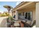 Covered patio seating area with a heater, and a stone paver base at 5224 E San Palo Dr, Pahrump, NV 89061