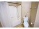 Bathroom includes tub/shower combo with white tile surround and updated fixtures at 5260 Del Lago Dr, Las Vegas, NV 89130