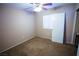 Cozy bedroom with neutral carpet, ceiling fan, and lots of light at 5260 Del Lago Dr, Las Vegas, NV 89130