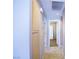 Hallway features tile flooring, linen closet, and access to bedrooms at 5260 Del Lago Dr, Las Vegas, NV 89130