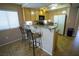 Kitchen with breakfast bar seating, lots of natural light, and modern appliances, great for casual dining at 5260 Del Lago Dr, Las Vegas, NV 89130