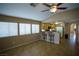 Open-concept living room with lots of natural light and a kitchen bar area at 5260 Del Lago Dr, Las Vegas, NV 89130