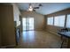 Comfortable living area with a corner fireplace, access to the patio, and lots of natural light at 5260 Del Lago Dr, Las Vegas, NV 89130