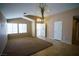 Inviting living room with tile floors, multiple windows, and an arched entryway; perfect for Gathering time at 5260 Del Lago Dr, Las Vegas, NV 89130