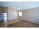Open living area with neutral walls, an archway, and tile floors creating a cozy atmosphere at 5260 Del Lago Dr, Las Vegas, NV 89130