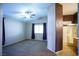 Bright main bedroom features neutral carpeting, a ceiling fan, and ensuite bathroom with a glass-enclosed shower at 5260 Del Lago Dr, Las Vegas, NV 89130