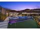 Luxury home with a pool and putting green, offering resort-style living with stunning views of the surrounding landscape at 535 Serenity Point Dr, Henderson, NV 89012
