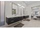 Modern bathroom with dual sinks, vanity, and a glass-enclosed shower at 535 Serenity Point Dr, Henderson, NV 89012