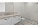 Clean bathroom with a floating vanity, stone countertop, glass shower, and modern fixtures at 535 Serenity Point Dr, Henderson, NV 89012