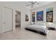 Modern bedroom featuring a minimalist design, sleek platform bed, and ensuite bathroom access at 535 Serenity Point Dr, Henderson, NV 89012