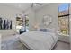 Serene bedroom featuring a modern bed, contemporary decor, and large windows showcasing picturesque views at 535 Serenity Point Dr, Henderson, NV 89012