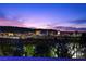Las Vegas skyline at night with colorful lights and mountain backdrop at 535 Serenity Point Dr, Henderson, NV 89012