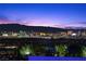 Enjoy breathtaking views of the Las Vegas strip from this home's elevated lot at 535 Serenity Point Dr, Henderson, NV 89012