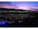 Expansive city view at night with a colorful skyline and distant mountains at 535 Serenity Point Dr, Henderson, NV 89012