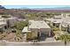 Stunning modern home featuring desert landscaping, a multi-car garage, and mountain views at 535 Serenity Point Dr, Henderson, NV 89012