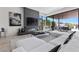 Stylish living room with a linear fireplace, comfortable seating, and access to the outdoor patio at 535 Serenity Point Dr, Henderson, NV 89012