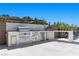 Modern outdoor kitchen featuring stainless steel appliances and countertop seating at 535 Serenity Point Dr, Henderson, NV 89012