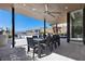 Spacious covered patio with a dining area and outdoor kitchen, ideal for hosting gatherings at 535 Serenity Point Dr, Henderson, NV 89012