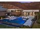 Stunning backyard pool with a spa, fire pit, and lounge chairs against a mountain backdrop at 535 Serenity Point Dr, Henderson, NV 89012