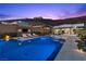 Inviting pool with an outdoor lounge area, complete with a TV and comfortable seating at 535 Serenity Point Dr, Henderson, NV 89012