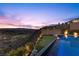 Beautiful pool with a view offers a putting green and mesmerizing sunsets, perfect for relaxation and entertainment at 535 Serenity Point Dr, Henderson, NV 89012