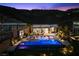 Stunning backyard oasis with pool, lounge chairs, and fire pit, perfect for entertaining under the stars at 535 Serenity Point Dr, Henderson, NV 89012