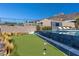 Enjoy outdoor fun with a putting green and a pool, perfect for recreation and relaxation in a private setting at 535 Serenity Point Dr, Henderson, NV 89012