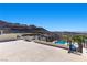 Spacious rooftop deck providing panoramic views of the mountains and golf course, enhanced with an adjacent pool at 535 Serenity Point Dr, Henderson, NV 89012