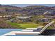 Scenic view from the property overlooking a golf course and surrounding hillside community at 535 Serenity Point Dr, Henderson, NV 89012