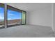 Bedroom with sliding glass doors to outside and scenic views offering a serene and inviting atmosphere at 563 Rock Peak Dr, Henderson, NV 89012