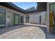 Contemporary home exterior showing expansive sliding glass doors and modern architectural details at 563 Rock Peak Dr, Henderson, NV 89012