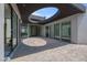 View of the modern home's exterior featuring an open courtyard design with a circular skylight at 563 Rock Peak Dr, Henderson, NV 89012