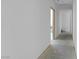 Bright hallway features neutral walls and leads to other areas of the home at 563 Rock Peak Dr, Henderson, NV 89012
