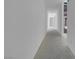 Bright, modern hallway with clean lines and recessed lighting leading to various rooms at 563 Rock Peak Dr, Henderson, NV 89012