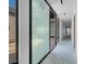 Bright hallway with large sliding glass doors providing natural light and easy access to the outdoors at 563 Rock Peak Dr, Henderson, NV 89012