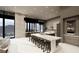 Modern kitchen with a large island, sleek countertops, and views of the pool at 563 Rock Peak Dr, Henderson, NV 89012