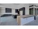 Modern kitchen with custom cabinets, a large island, and sleek countertops at 563 Rock Peak Dr, Henderson, NV 89012