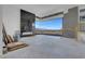 Spacious living area with a modern fireplace and expansive windows offering panoramic views at 563 Rock Peak Dr, Henderson, NV 89012