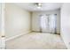 Well-lit bedroom with plush carpet and a window dressed with patterned curtains at 5751 E Hacienda Ave # 243, Las Vegas, NV 89122