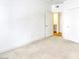 Cozy bedroom with soft carpet, closet, and bright doorway leading to the kitchen at 5751 E Hacienda Ave # 243, Las Vegas, NV 89122