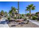 Community grounds adorned with mature palm trees, decorative rocks and shrubs for a relaxing atmosphere at 5751 E Hacienda Ave # 243, Las Vegas, NV 89122
