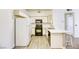 Kitchen featuring white cabinets and black appliances, including a gas range at 5751 E Hacienda Ave # 243, Las Vegas, NV 89122