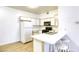 Bright kitchen featuring white cabinets, a gas range, and a convenient breakfast bar at 5751 E Hacienda Ave # 243, Las Vegas, NV 89122