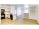 Open concept kitchen with stainless steel sink, black appliances, and bar seating at 5751 E Hacienda Ave # 243, Las Vegas, NV 89122