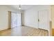 Bright living room with hardwood floors, ceiling fan, and natural light at 5751 E Hacienda Ave # 243, Las Vegas, NV 89122