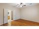 Light-filled bedroom with wood-look floors and an en-suite bathroom at 6076 Wheat Penny Ave, Las Vegas, NV 89122