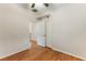 Bedroom showcasing wood floors, a ceiling fan, and a closet with double doors at 6076 Wheat Penny Ave, Las Vegas, NV 89122