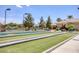 Bocce ball court surrounded by desert landscaping, shade trees, and park benches at 6076 Wheat Penny Ave, Las Vegas, NV 89122